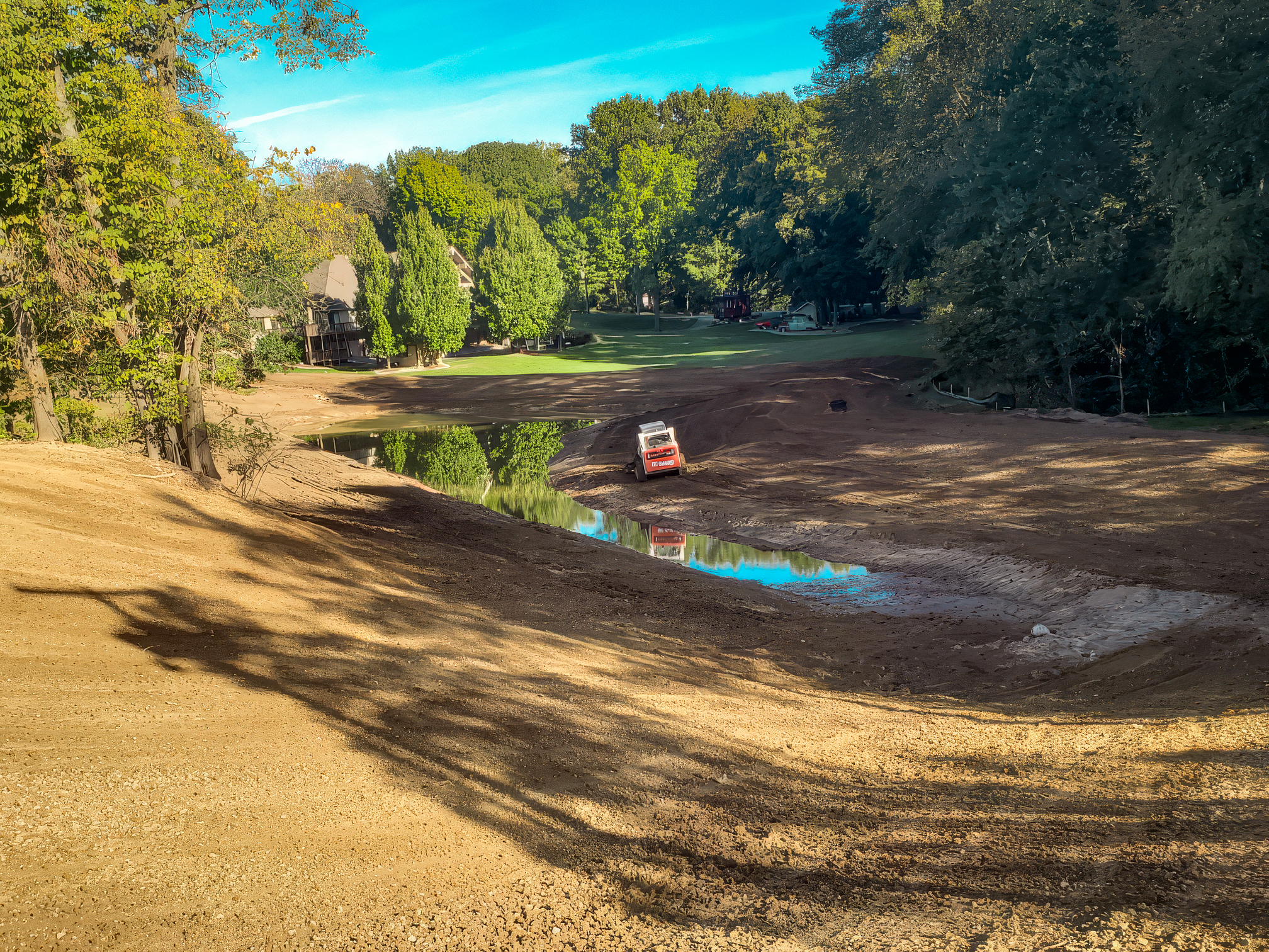 Bobcat working to prevent soil erosion in waterway Bobcat working to prevent soil erosion in waterway