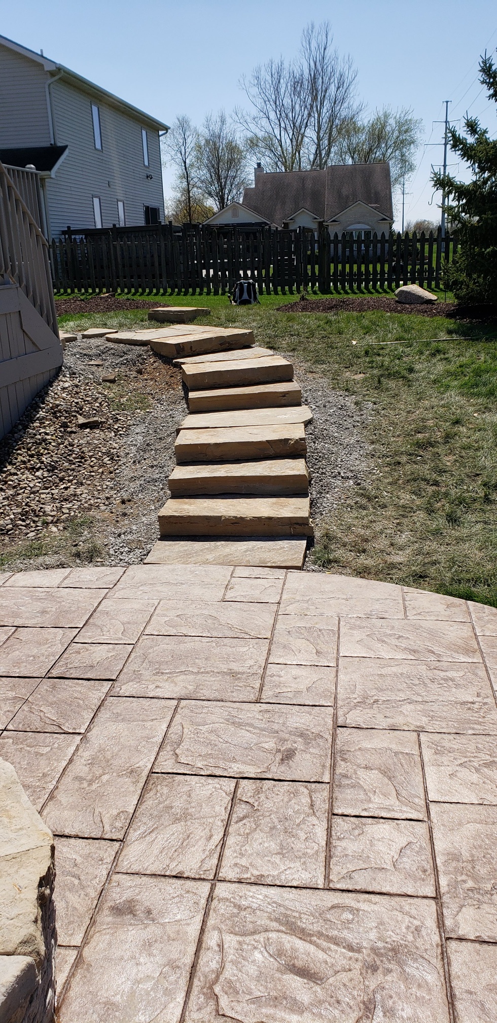 stone path in back yard leading to a stamped concrete patio stone path in back yard leading to a stamped concrete patio