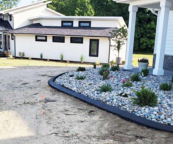 view of concrete edging in a newly landscaped front yard view of concrete edging in a newly landscaped front yard