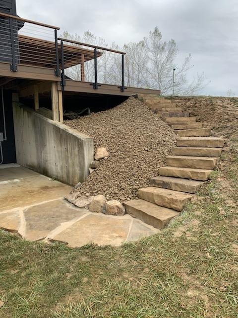 view of stone slab path down a back yard on a hill view of stone slab path down a back yard on a hill